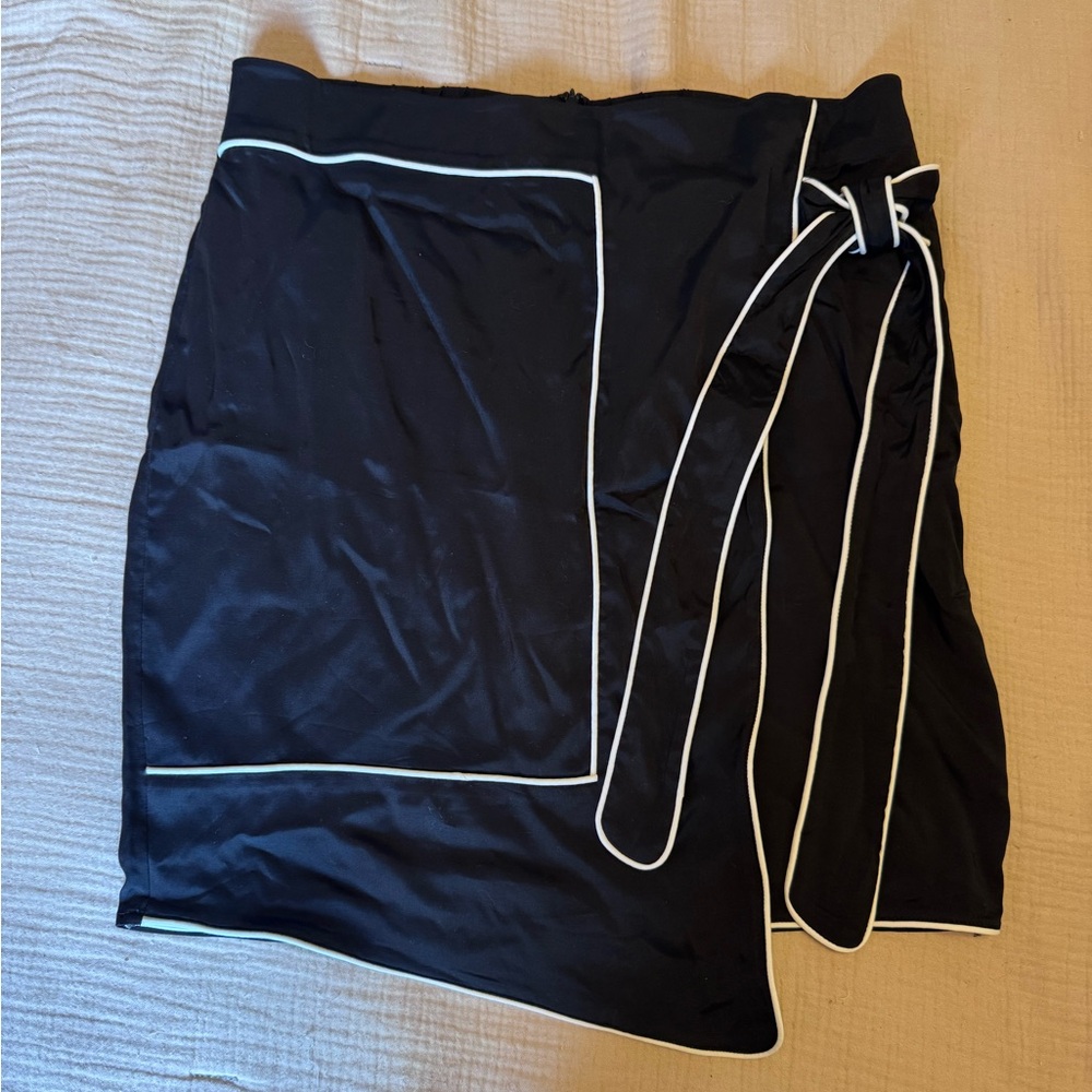 Universal Standard black wrap skirt with white contrast trim